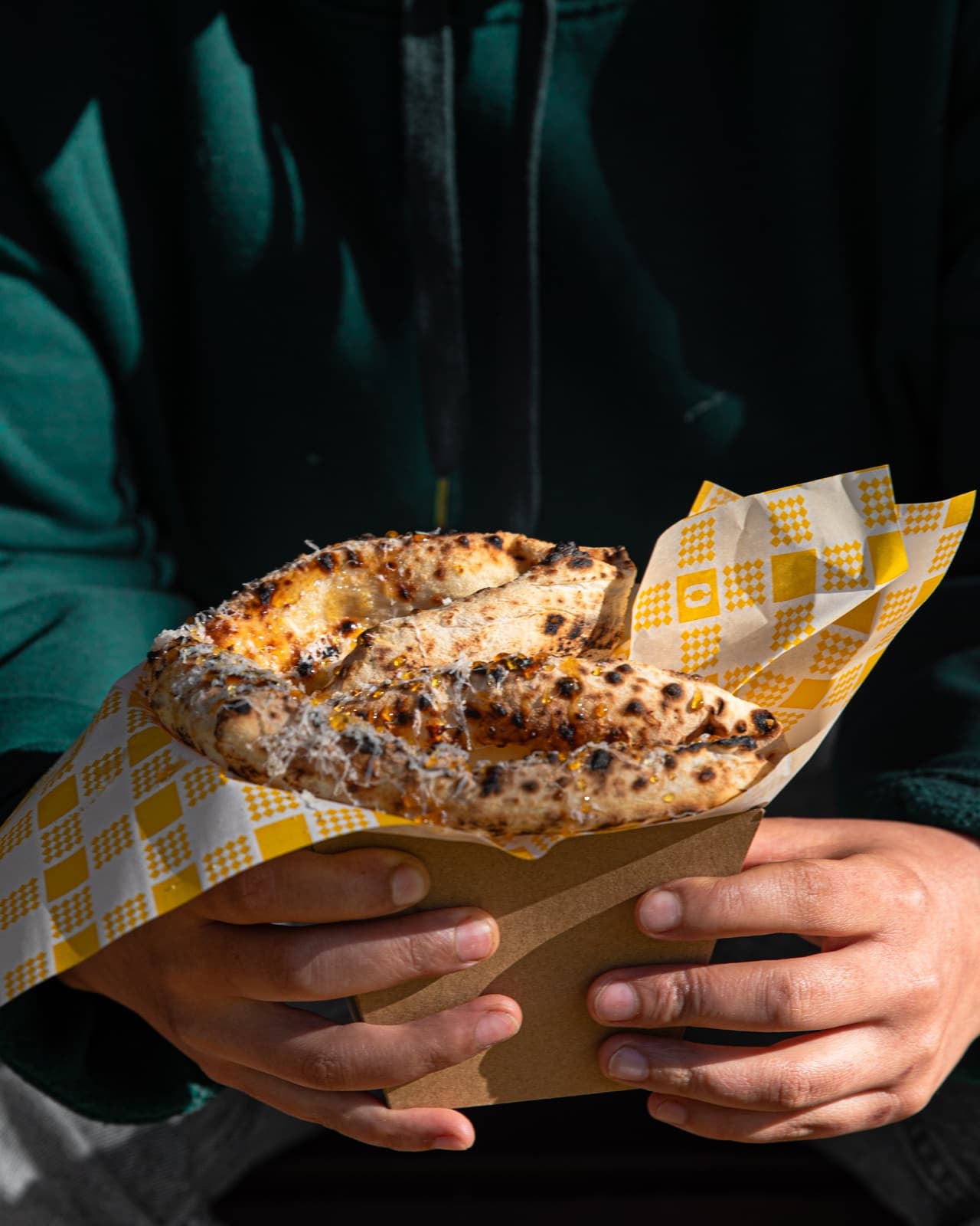 Hot Honey Havoc Pizzino in a takeaway box, front zoom