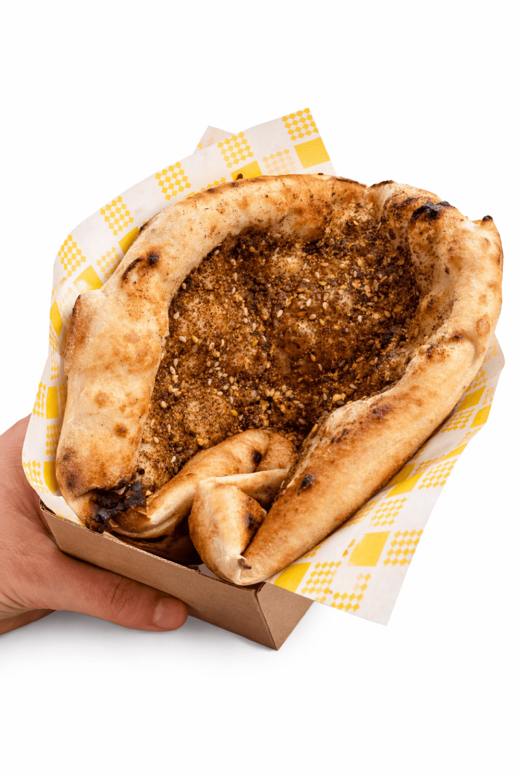 Za'atar & Olives Pizzino, point-of-view shot showing spice and black olives