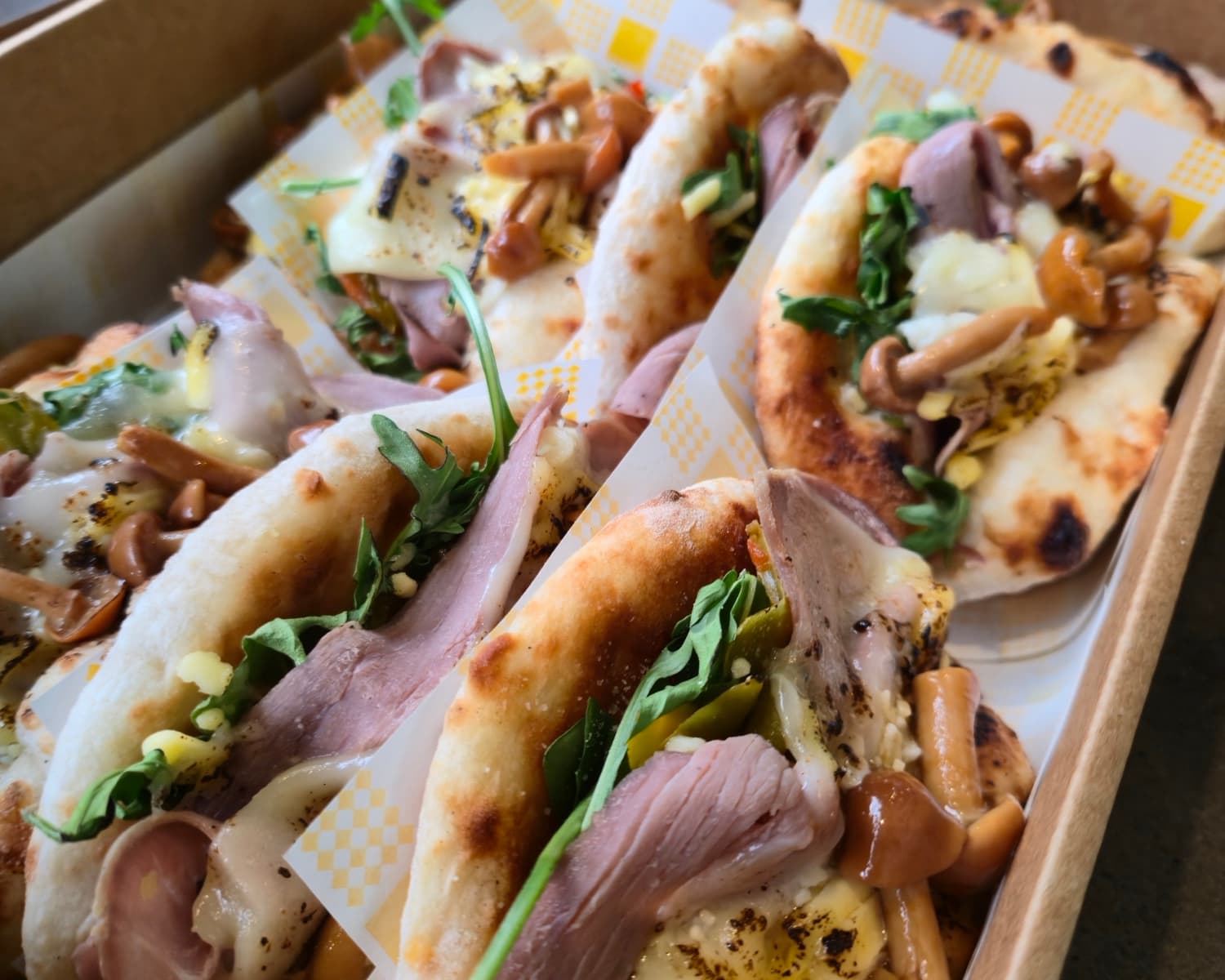 An Eat Ozzo catering box of San Daniele prosciutto deli Ozzos, delivered to a Sydney CBD office
